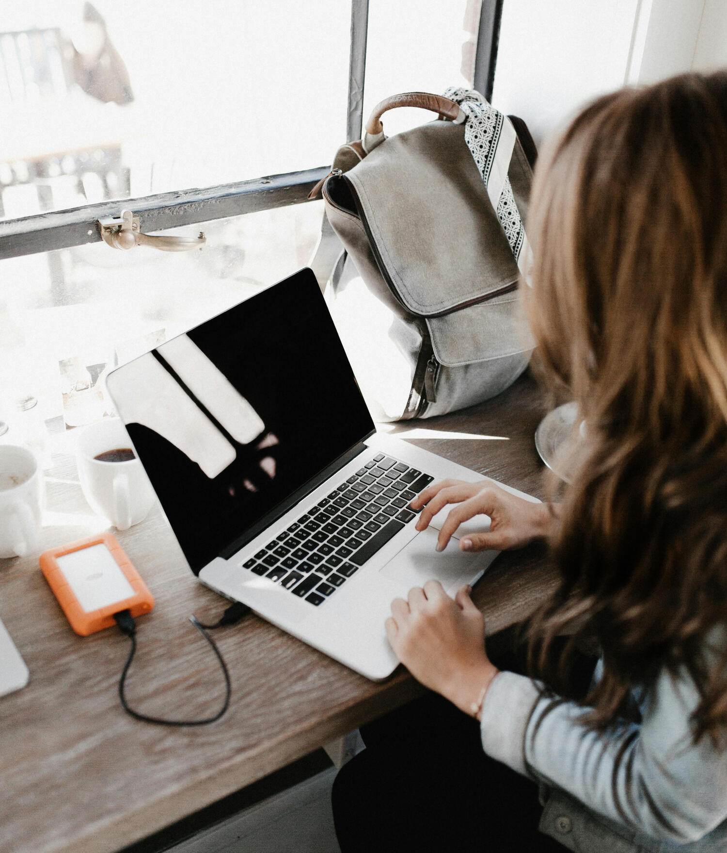 a woman working on a laptop